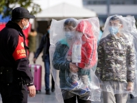 EN IMAGES - La vie quotidienne en Chine au coeur du Coronavirus